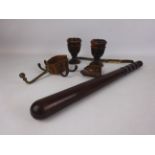 Pair of Lignum Vitae turned cups, a truncheon with leather strap,