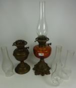 Victorian cast metal and amber glass oil lamp,