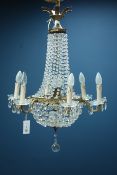 Six branch gilt metal and cut glass basket chandelier with prismatic drops Condition