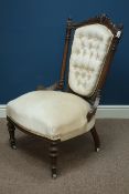 Victorian walnut nursing chair upholstered in beige buttoned fabric,