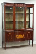 Edwardian inlaid mahogany break bow front display cabinet, three glazed doors above three cupboards,