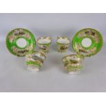 Pair of 19th century Copeland & Garrett porcelain trios painted with named landscape views of