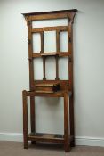 Early 20th century oak hall stand, hinged compartment, with bevelled mirror back, W82cm, H189cm,