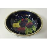 Moorcroft Wisteria and Plum pattern circular bowl with silver plated rim,