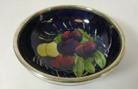 Moorcroft Wisteria and Plum pattern circular bowl with silver plated rim,