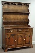 Medium oak three drawer dresser with three panelled cupboards and raised plate rack, W122cm, H182cm,
