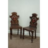 Pair Victorian carved oak hall chairs,