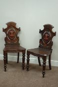 Pair Victorian carved oak hall chairs,