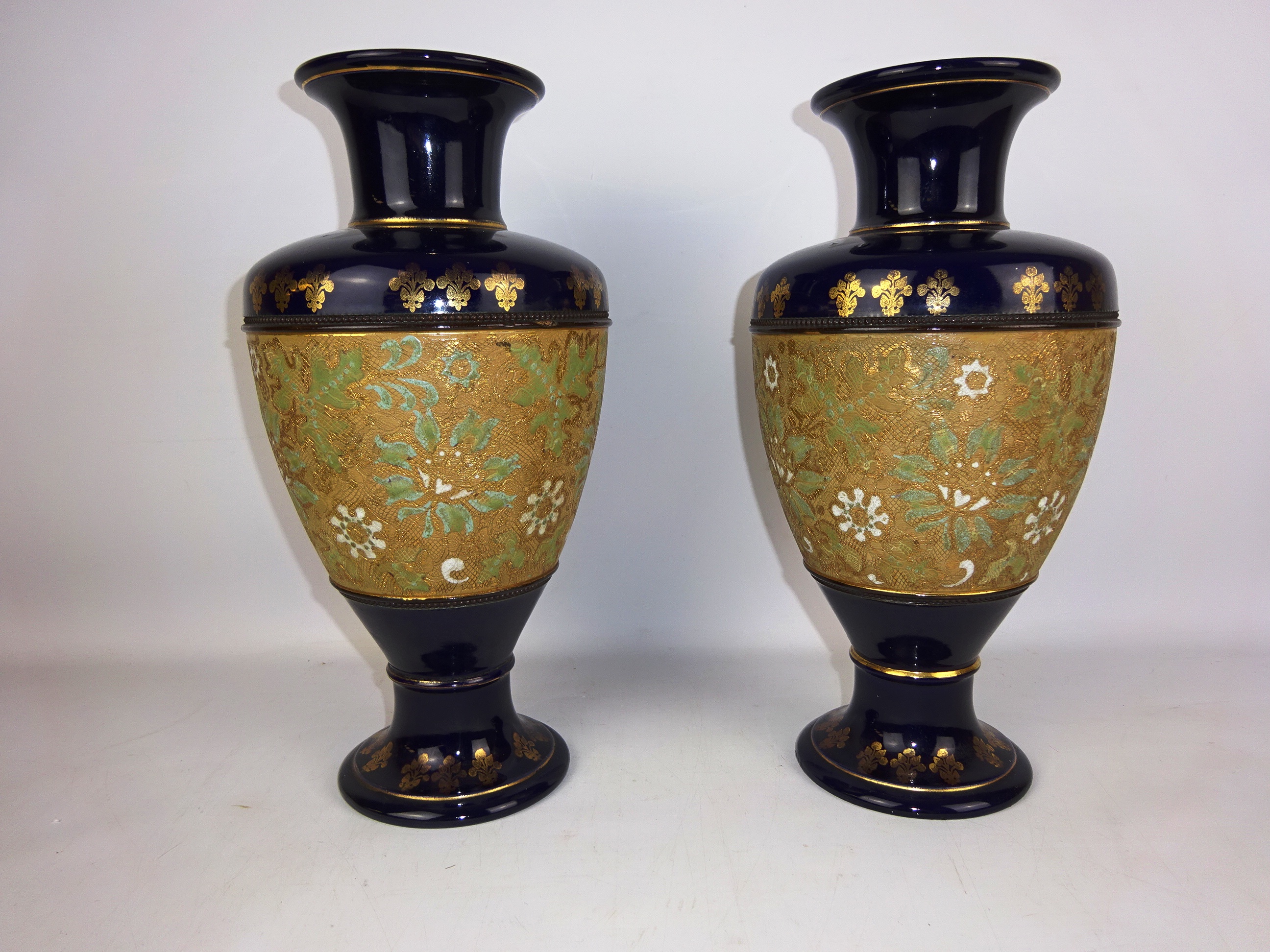 Pair of Doulton Slater's urn shaped vases, with a band of gilt & enamel foliage, impressed marks,