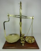Set of early 20th Century brass scales with additional weights by W & T Avery Condition
