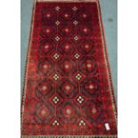 Persian red and blue ground rug, repeating motif design,