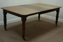 Early 20th century oak telescopic dining table with two leaves,