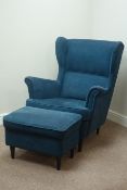 Modern Strandmon wing back armchair upholstered in dark blue fabric and matching footstool