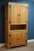 Light oak cabinet fitted with four cupboards, W104cm, H195cm,