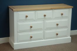 White painted seven drawer chest with light oak top, W130cm, H81cm,