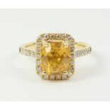 Oval yellow sapphire and diamond cluster ring stamped 750 Condition Report <a