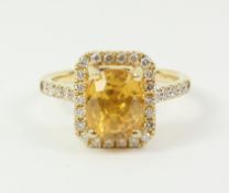 Oval yellow sapphire and diamond cluster ring stamped 750 Condition Report <a