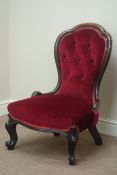 Victorian carved walnut framed upholstered nursing chair, shaped top,