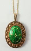 Continental green enamel and gold pendant necklace indistinct marks and 9ct import hallmarks