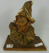 Pottery bust of a pierrot / performer signed on back G.