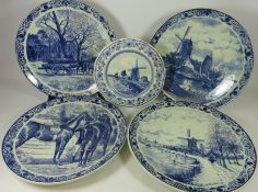 Set of four 'Delft Blauw' Chemkefa circular blue and white chargers decorated with rural scenes and