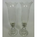 Pair of Baccarat crystal candle holders with etched decoration and spiralling base,