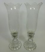 Pair of Baccarat crystal candle holders with etched decoration and spiralling base,