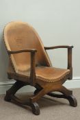 Early 20th century X-framed leather upholstered chair,