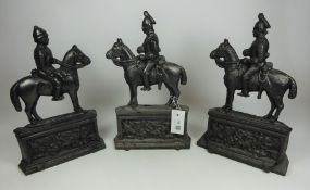 Victorian cast iron fire depicting a Knight and horse and two other similar fire dogs (3)