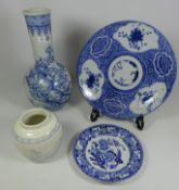 19th Century blue and white Japanese shallow dish and another Japanese bottle vase decorated with