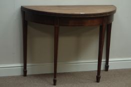 George III mahogany demi-lune fold over tea table, on twin gateleg base, tapering spade foot legs,