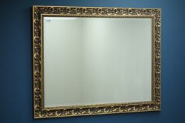 Ornate gilt framed rectangular mirror, bevelled glass,