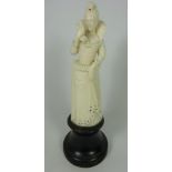 19th / Early 20th Century European carved ivory model of a Lady in jewelled dress with a hawk,