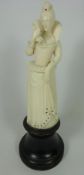 19th / Early 20th Century European carved ivory model of a Lady in jewelled dress with a hawk,