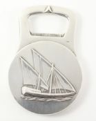 Christofle France Art Deco silver-plated bottle opener with sailing boat decoration to one side and