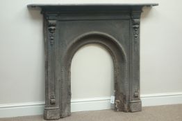 Victorian ornate cast iron fire surround, arched aperture,