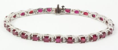 Oval ruby and diamond white gold bracelet stamped 14k Condition Report <a