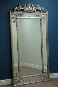 Large rectangular French style wall mirror in carved gilt cushion frame,