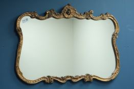 Ornate shaped gilt framed mirror with bevelled glass and two other gilt framed mirror