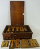 Selection of mid 20th Century uppercase alphabet printing blocks in wooden case