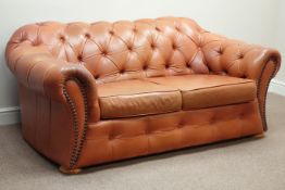 Three seat Chesterfield sofa upholstered in buttoned tan leather,