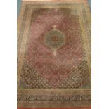 Persian Bidjar pale red ground rug with green boarders, Heratti motif,