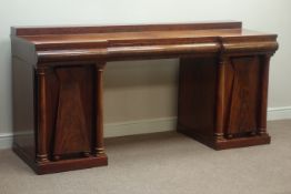 19th century mahogany three drawer sideboard, with figured mahogany doors with geometric panelling,