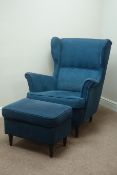 Modern Strandmon wing back armchair upholstered in dark blue fabric and matching footstool