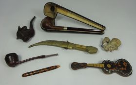 Tortoiseshell model of a guitar, carved wooden pipe in the form of a bulls head, two walnut pipes,
