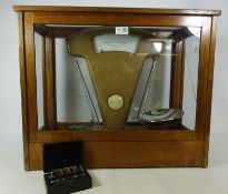 Set of Avery shop scales in glass case and a set of Griffin & Tatlock Microid Metric Weights