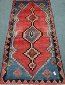 Persian wool Shiraz red ground rug with pole medallion,