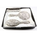 Hallmarked silver four piece dressing table set embossed with cherubs Condition Report