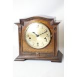 Early 20th century oak mantel clock in architectural case with Westminster chime,