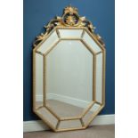 Octagonal wall mirror in gilt frame with sectional mirrored border and ornate pediment, W88cm,